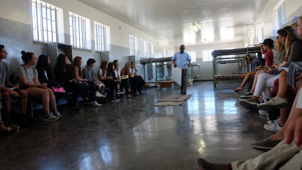 Class visit to a prison and meeting with a prisoner on Robben Island