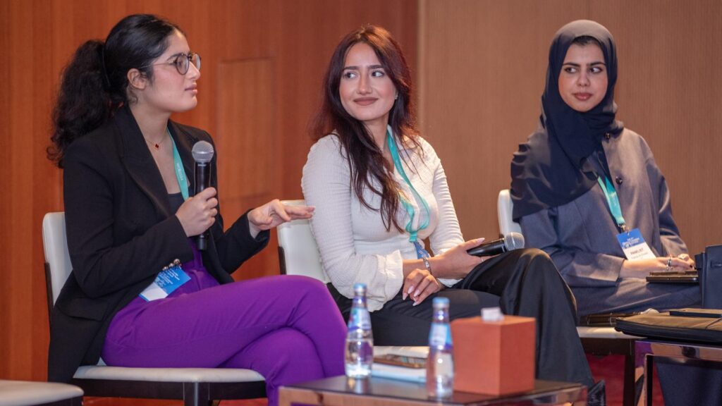 students Fatma Al-Emadi, Rafal Sarout, and Maya Saqr